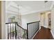 Bright hallway with hardwood floors, chandelier, and view through arched window at 220 Galesburg Dr, Lawrenceville, GA 30044