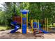 Community playground with slides, climbing wall, and monkey bars set in a wooded, natural environment at 220 Galesburg Dr, Lawrenceville, GA 30044