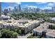 Atlanta skyline visible behind apartment complex featuring rooftop parking and landscaped grounds at 400 17Th Nw St # 1119, Atlanta, GA 30363