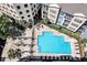 Aerial view of a community pool surrounded by lounge chairs and lush landscaping at 400 17Th Nw St # 1119, Atlanta, GA 30363