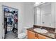 Well lit bathroom featuring granite counters, a walk-in closet, and ample space at 400 17Th Nw St # 1119, Atlanta, GA 30363