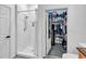 Modern bathroom with a sleek walk-in shower, stylish fixtures, and a well-organized walk-in closet at 400 17Th Nw St # 1119, Atlanta, GA 30363