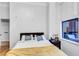 Serene bedroom with soft lighting, comfortable bed, and minimalist decor for a peaceful retreat at 400 17Th Nw St # 1119, Atlanta, GA 30363