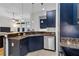 Well-appointed kitchen featuring granite countertops, stainless steel appliances, and elegant pendant lighting at 400 17Th Nw St # 1119, Atlanta, GA 30363