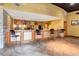 Bar and kitchen with seating and colorful backsplash with tiled floors at 400 17Th Nw St # 1119, Atlanta, GA 30363
