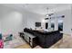 Cozy living room with a spacious sectional, modern lighting, and access to an outdoor balcony at 400 17Th Nw St # 1119, Atlanta, GA 30363