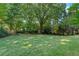 Lush green backyard providing ample space for recreation and outdoor activities at 4261 Brookview Se Dr, Atlanta, GA 30339