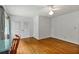 Light-filled bedroom with hardwood floors, a ceiling fan, and large closet with double doors at 4261 Brookview Se Dr, Atlanta, GA 30339