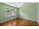 Bedroom with hardwood floors, natural light from a window and a closet with doors at 4261 Brookview Se Dr, Atlanta, GA 30339