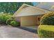Attached carport for two cars with brick accents and mature landscaping at 4261 Brookview Se Dr, Atlanta, GA 30339