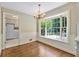 Bright dining area featuring a large bay window and access to the kitchen with stainless appliances at 4261 Brookview Se Dr, Atlanta, GA 30339