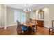 Classic dining room featuring hardwood floors, chandelier lighting, and a large dining table at 4261 Brookview Se Dr, Atlanta, GA 30339