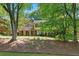 Two-story home with shutters and brick accents sits on a well-manicured lawn at 4261 Brookview Se Dr, Atlanta, GA 30339