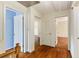 Hallway showcasing hardwood floors and access to multiple rooms, with white trim at 4261 Brookview Se Dr, Atlanta, GA 30339