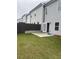 Backyard featuring a small concrete patio and a grassy area at 6423 Rosetta Drive, Unit 66 # 66, South Fulton, GA 30331