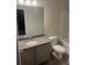 Bathroom featuring a granite-topped vanity and shower-tub combo at 6423 Rosetta Drive, Unit 66 # 66, South Fulton, GA 30331
