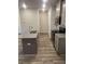 Bright kitchen with an island, stainless steel appliances, and gray cabinets at 6423 Rosetta Drive, Unit 66 # 66, South Fulton, GA 30331