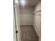 Spacious walk-in closet featuring wire shelving and neutral carpeting at 6423 Rosetta Drive, Unit 66 # 66, South Fulton, GA 30331