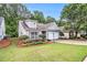 Well maintained single-story home features a manicured lawn, established landscaping, and a welcoming facade at 712 Brambling Way, Stockbridge, GA 30281