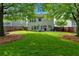 Expansive backyard features lush lawn, mature trees and patio, perfect for outdoor enjoyment at 813 Poplar Ter, Canton, GA 30115