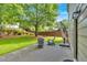 A cozy patio with comfortable seating and a grill nestled in a lush green yard at 813 Poplar Ter, Canton, GA 30115