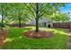 Lush backyard with tall trees and a wooden fence at 813 Poplar Ter, Canton, GA 30115