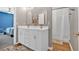 Bright bathroom featuring double sink vanity with modern fixtures and a shower with curtain at 813 Poplar Ter, Canton, GA 30115