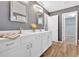 Main bathroom featuring double vanity sinks, updated countertops, and ample storage space at 813 Poplar Ter, Canton, GA 30115