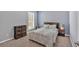 Bedroom with natural light and a queen bed near modern furniture at 813 Poplar Ter, Canton, GA 30115