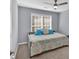 Charming bedroom with daybed, cozy quilt, and natural light from the window at 813 Poplar Ter, Canton, GA 30115