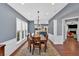 Elegant dining area featuring hardwood floors, neutral walls, and access to the kitchen and living room at 813 Poplar Ter, Canton, GA 30115