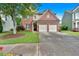 Traditional two-story brick home with a two-car garage and a green lawn in a suburban neighborhood at 813 Poplar Ter, Canton, GA 30115