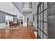 Grand foyer featuring hardwood floors, a staircase, and an open view of the dining and kitchen areas at 813 Poplar Ter, Canton, GA 30115