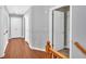 Hallway with wood floors leading to various rooms at 813 Poplar Ter, Canton, GA 30115