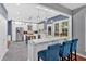 Modern kitchen with stainless steel appliances, white cabinets, and a breakfast bar with seating at 813 Poplar Ter, Canton, GA 30115