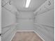 Spacious walk-in closet features gray walls, wire shelving, and neutral carpet at 813 Poplar Ter, Canton, GA 30115