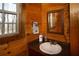 The bathroom has wood paneled walls, a stone counter, and a view of the outdoors at 1225 Pitts Chapel, Newborn, GA 30056