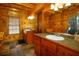 The wooden bathroom has double vanities and a large mirror, for plenty of space at 1225 Pitts Chapel, Newborn, GA 30056