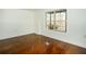 Bright bedroom with hardwood floors and a large window with views of the surrounding trees at 1225 Pitts Chapel, Newborn, GA 30056