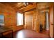 Charming wood-paneled bedroom features a cozy ladder leading to a loft and a vintage sewing machine detail at 1225 Pitts Chapel, Newborn, GA 30056