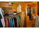 A closet with custom shelving, and ironing board, leading into the bathroom at 1225 Pitts Chapel, Newborn, GA 30056