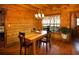 Cozy dining room with wooden table, chairs, and window views at 1225 Pitts Chapel, Newborn, GA 30056