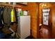 Hallway with storage, refrigerator, and an entrance to the deck with a striped curtain at 1225 Pitts Chapel, Newborn, GA 30056