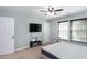 A cozy bedroom features double windows and neutral decor at 1570 Shire Village Dr, Sugar Hill, GA 30518