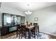 Charming dining room with stylish furnishings, contemporary lighting, and an inviting atmosphere at 1570 Shire Village Dr, Sugar Hill, GA 30518