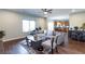 Inviting living room featuring wood floors, sofa, chair and view of kitchen at 1570 Shire Village Dr, Sugar Hill, GA 30518