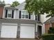 Charming townhome with a two-car garage and gray siding at 2107 Hailston Dr, Duluth, GA 30097