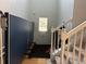 Inviting hallway with stairs and a decorative entry door at 2107 Hailston Dr, Duluth, GA 30097
