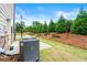 Landscaped backyard with a well-manicured lawn and patio at 2170 Trelipe Dr, Lawrenceville, GA 30044