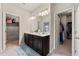 Bathroom with double sinks and adjacent walk-in closets at 2170 Trelipe Dr, Lawrenceville, GA 30044